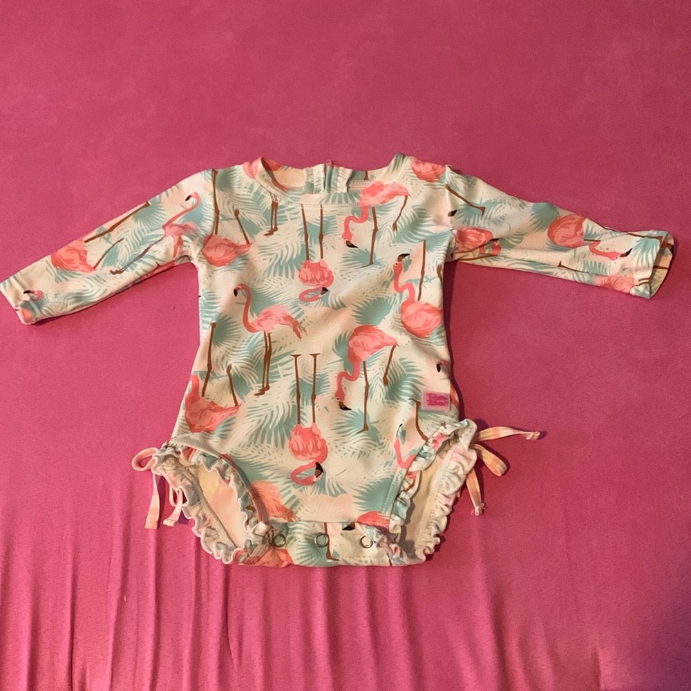 RuffleButts long sleeve one piece flamingo rashguard